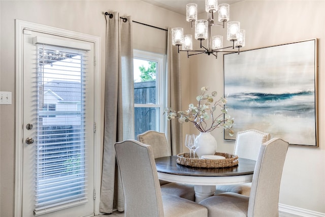 8741 Bigelow Dr, Plano, TX 75024 - dining area featuring a chandelier