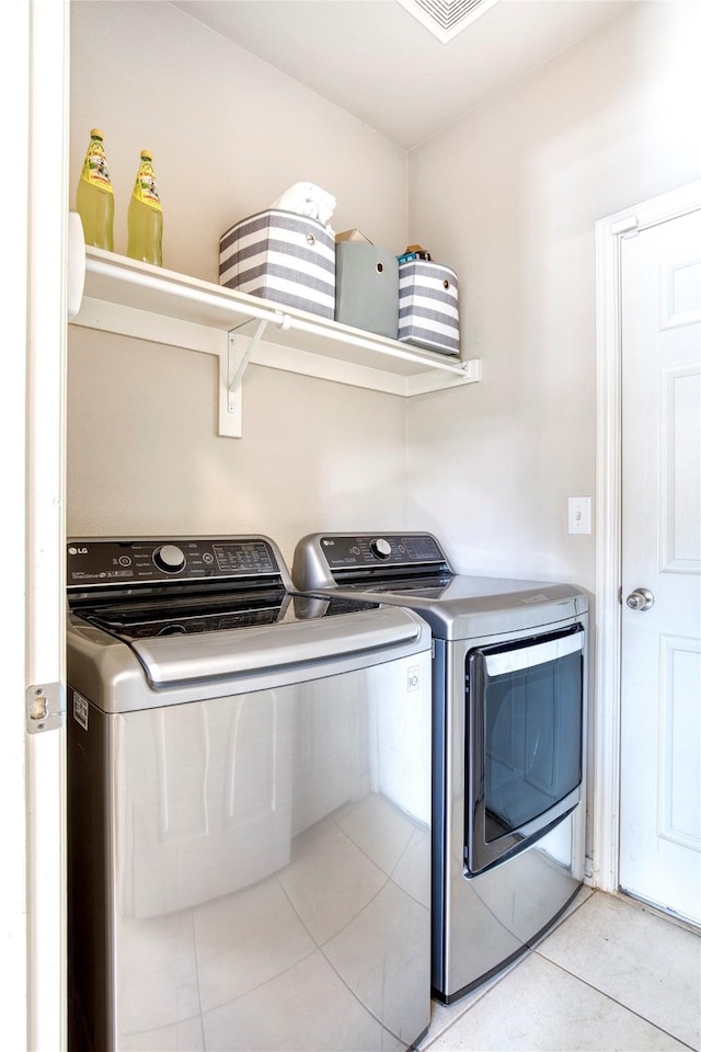 8741 Bigelow Dr, Plano, TX 75024 - washroom with separate washer and dryer and light tile patterned flooring