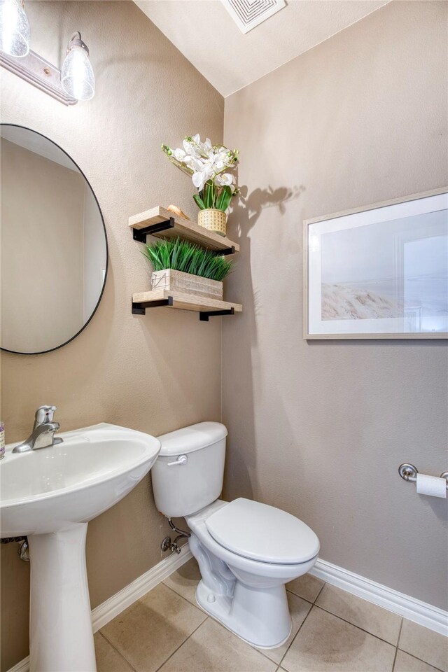8741 Bigelow Dr, Plano, TX 75024 - bathroom with toilet, tile patterned flooring, and baseboards