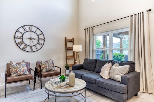 8741 Bigelow Dr, Plano, TX 75024 - living room with light wood-style floors and baseboards