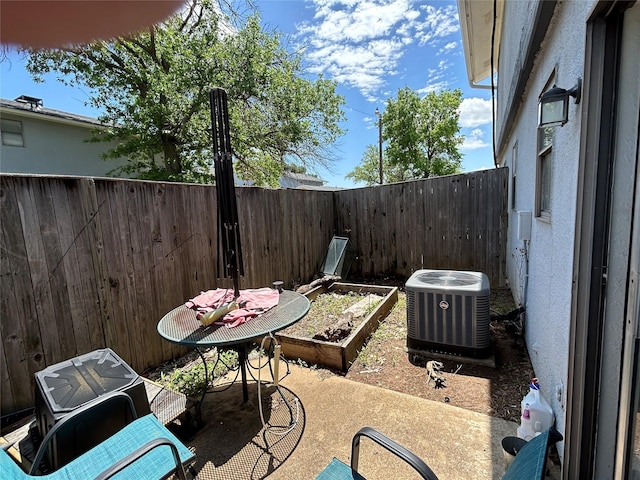 612 Ridgeline Dr, Hurst, TX 76053 - view of patio with central air condition unit and a fenced backyard