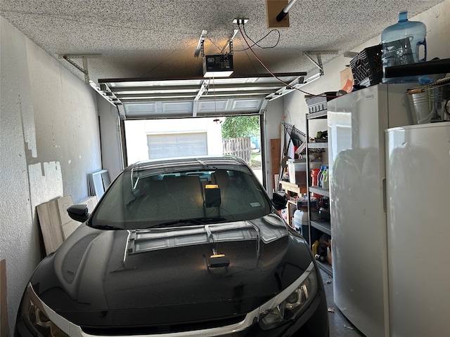 612 Ridgeline Dr, Hurst, TX 76053 - garage with a garage door opener and a textured wall
