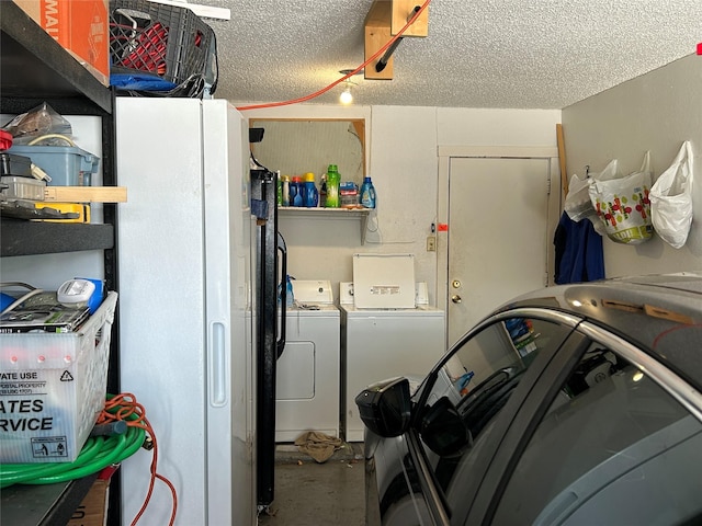 612 Ridgeline Dr, Hurst, TX 76053 - garage featuring washer and clothes dryer and freestanding refrigerator