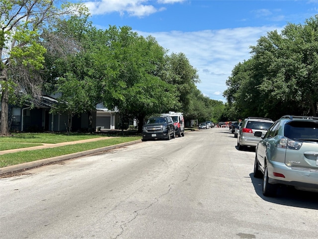 612 Ridgeline Dr, Hurst, TX 76053 - view of asphalt street featuring sidewalks and curbs