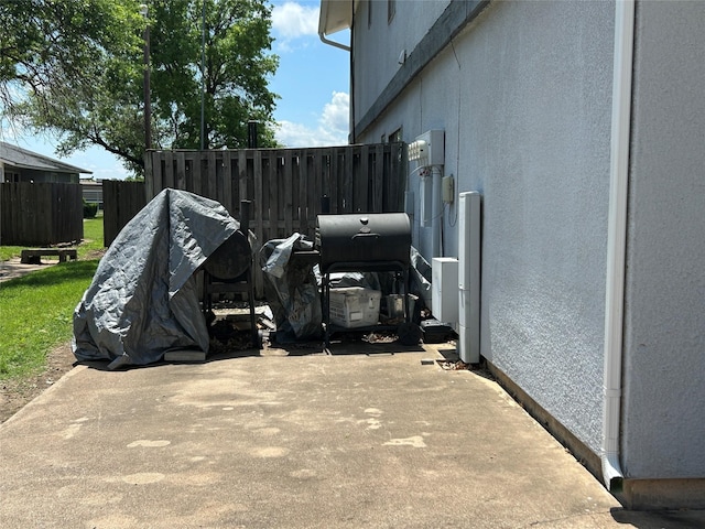 612 Ridgeline Dr, Hurst, TX 76053 - view of patio / terrace with fence and a grill