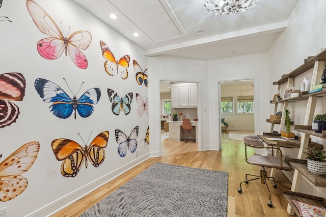 hallway with recessed lighting, light wood-style flooring, and baseboards