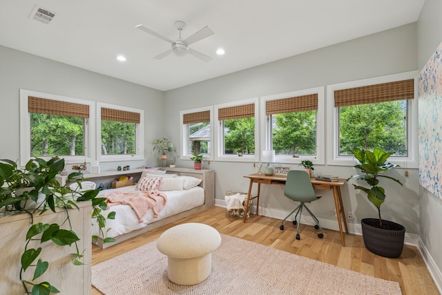 interior space with recessed lighting, wood finished floors, visible vents, and baseboards