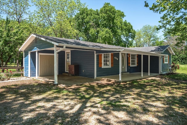 exterior space with a porch and a carport
