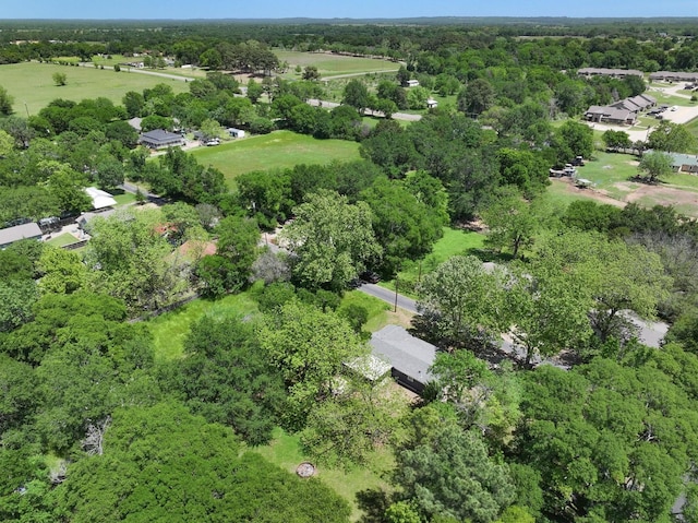 bird's eye view featuring a wooded view