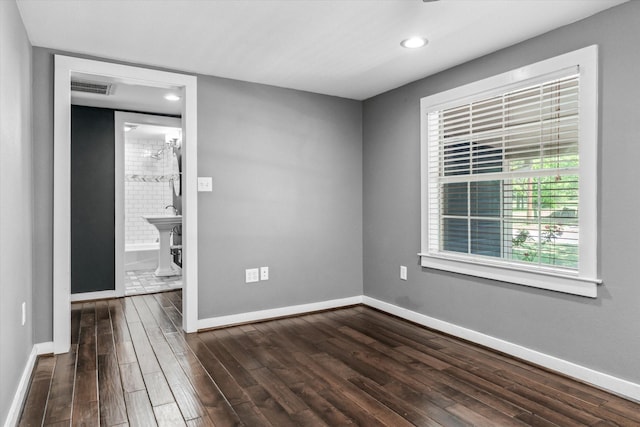unfurnished bedroom with visible vents, baseboards, recessed lighting, and dark wood-type flooring