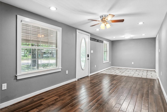 foyer featuring ceiling fan, baseboards, wood finished floors, and recessed lighting