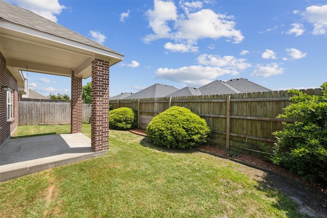 view of yard with a fenced backyard and a patio