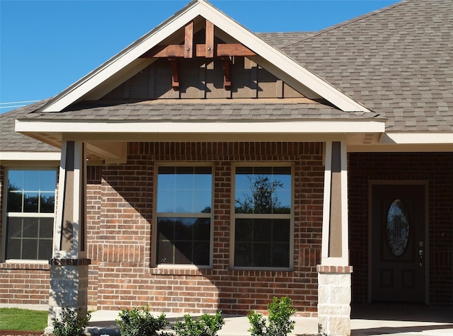 725 Raylan St, Springtown, TX 76082 - doorway to property with brick siding and roof with shingles