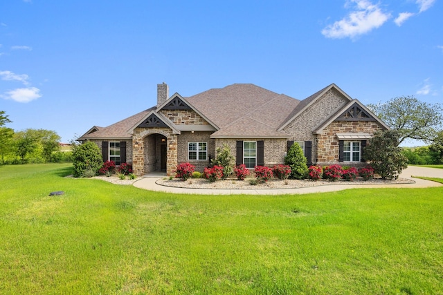 56 Turtle Point Ln, Gordonville, TX 76245 - craftsman-style house featuring a chimney, a shingled roof, brick siding, and a front yard