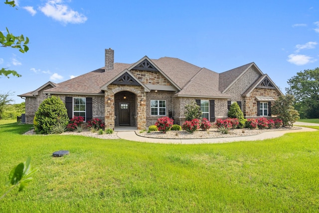 56 Turtle Point Ln, Gordonville, TX 76245 - craftsman-style home featuring brick siding, a chimney, and a front yard