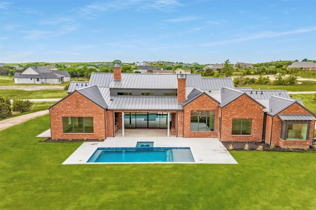 2016 Meadowlark, Aledo, TX 76008 - back of property featuring brick siding, a chimney, a patio area, and a standing seam roof