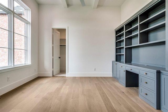 2016 Meadowlark, Aledo, TX 76008 - unfurnished office featuring built in desk, light wood-style floors, beam ceiling, and baseboards