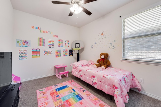 carpeted bedroom featuring ceiling fan, baseboards, and multiple windows