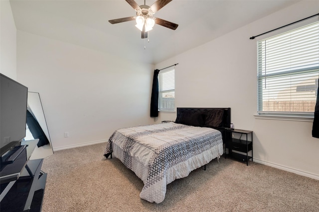 bedroom featuring carpet floors, a ceiling fan, and baseboards
