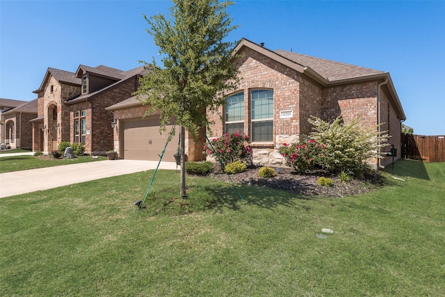 view of front of home with brick siding, an attached garage, a front lawn, and concrete driveway