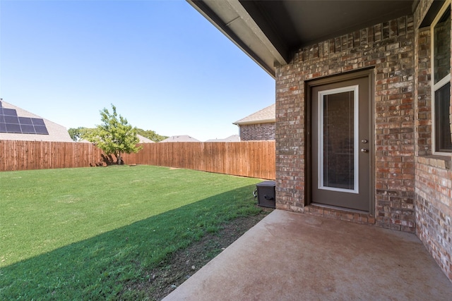 view of yard with a patio area and a fenced backyard