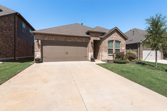 view of front of home with concrete driveway, a garage, brick siding, a shingled roof, and a front yard