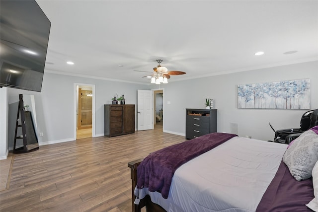 bedroom with baseboards, wood finished floors, and recessed lighting