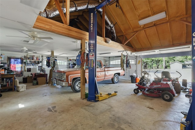 garage with visible vents and ceiling fan