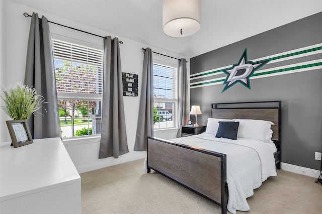 carpeted bedroom with baseboards