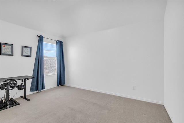 carpeted empty room with baseboards