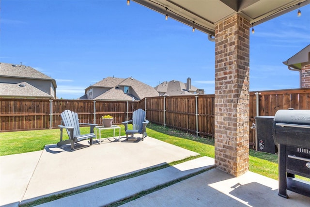 view of patio with a fenced backyard