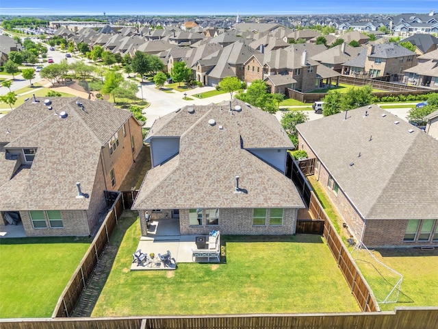 birds eye view of property with a residential view