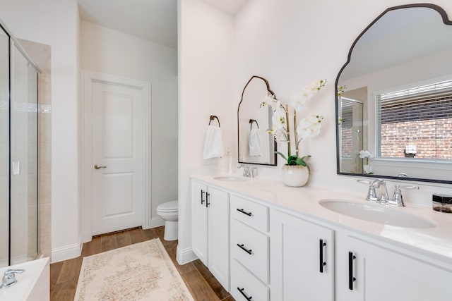 11225 Klondike Ln, Aubrey, TX 76227 - full bathroom with double vanity, toilet, a shower stall, and a sink