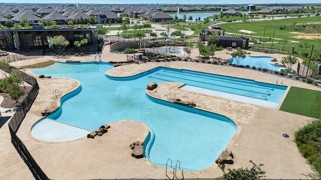 11225 Klondike Ln, Aubrey, TX 76227 - community pool with a patio, a water view, fence, and a residential view