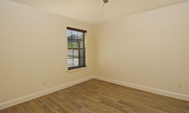 217 Timber Valley Ct, Weatherford, TX 76085 - empty room featuring baseboards, wood finished floors, and ceiling fan