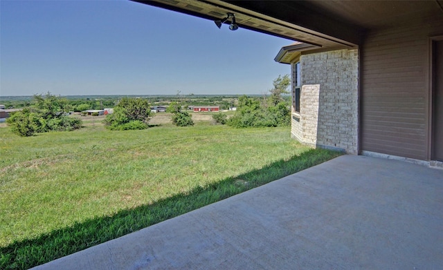 217 Timber Valley Ct, Weatherford, TX 76085 - view of grassy yard with a patio area