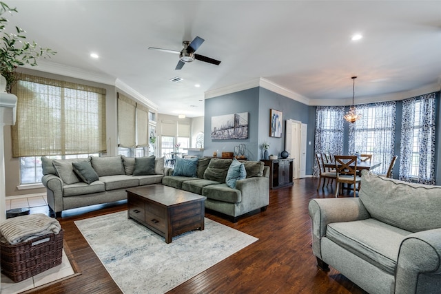 living room with visible vents, recessed lighting, ornamental molding, and a healthy amount of sunlight