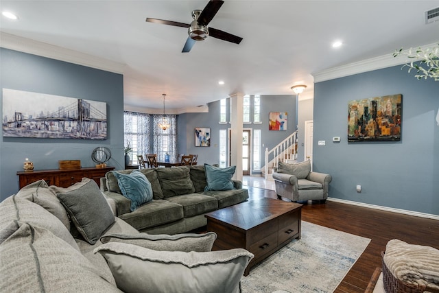living area featuring recessed lighting, stairway, wood finished floors, and ceiling fan with notable chandelier