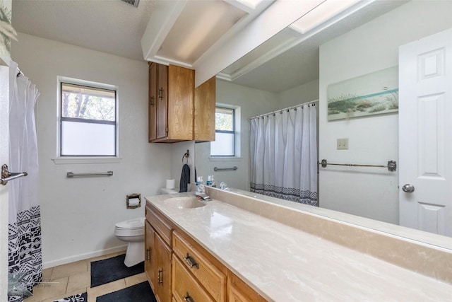 full bathroom with vanity, curtained shower, baseboards, toilet, and visible vents
