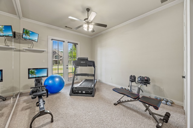 workout area with visible vents, a ceiling fan, carpet floors, crown molding, and baseboards