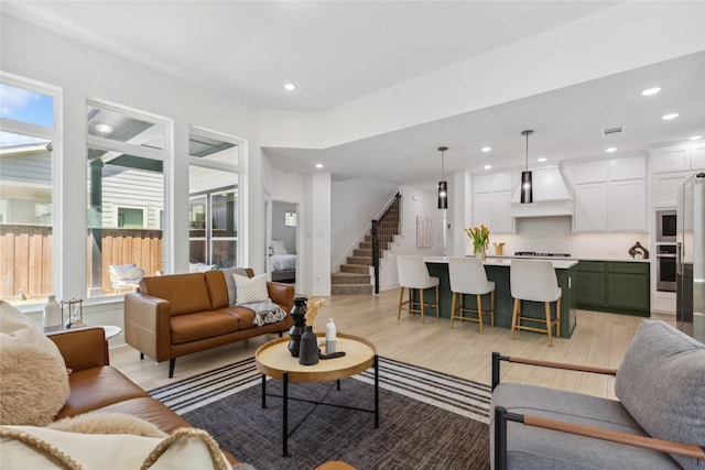 13361 Hedgebrook Pl, Fort Worth, TX 76008 - living room with light wood-style floors, stairs, and recessed lighting