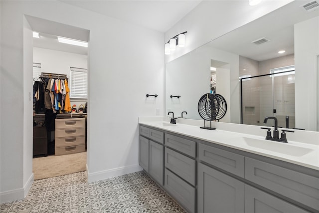 13361 Hedgebrook Pl, Fort Worth, TX 76008 - bathroom with baseboards, a stall shower, a walk in closet, and double vanity
