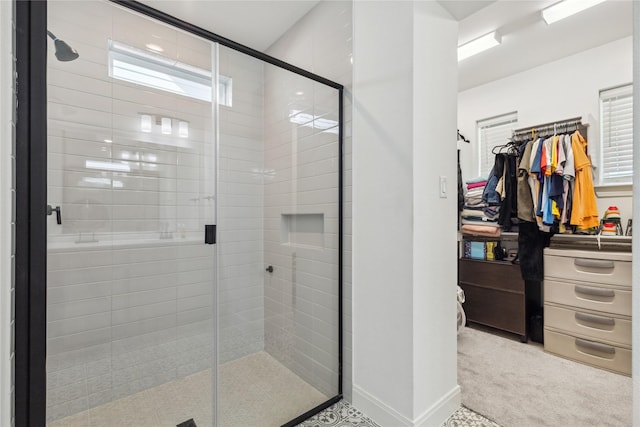 13361 Hedgebrook Pl, Fort Worth, TX 76008 - bathroom featuring a shower stall, a walk in closet, and baseboards