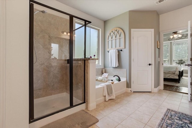 bathroom with tile patterned flooring, a bath, ensuite bath, baseboards, and a stall shower