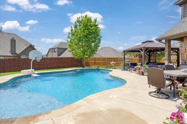 view of swimming pool featuring a gazebo, a fenced in pool, a fenced backyard, and a patio