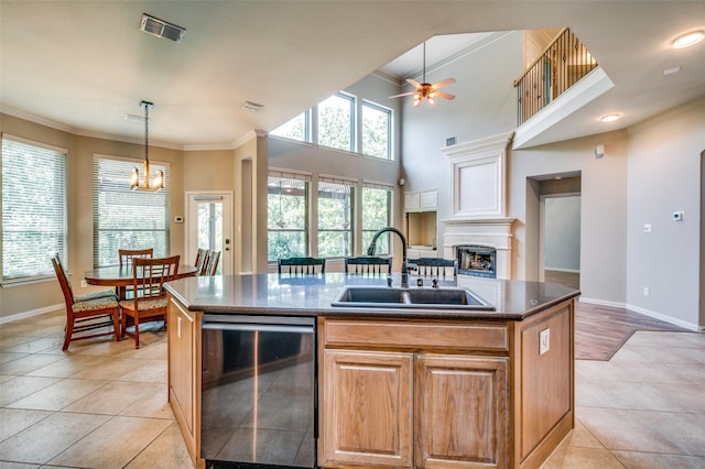 103 Lakehill Ct, Hickory Creek, TX 75065 - kitchen featuring a sink, a ceiling fan, baseboards, an island with sink, and crown molding