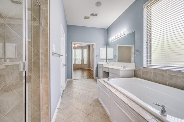 103 Lakehill Ct, Hickory Creek, TX 75065 - full bathroom featuring a stall shower, a bath, and tile patterned flooring