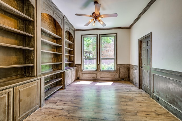 103 Lakehill Ct, Hickory Creek, TX 75065 - spare room with ornamental molding, light wood-type flooring, wainscoting, and a ceiling fan