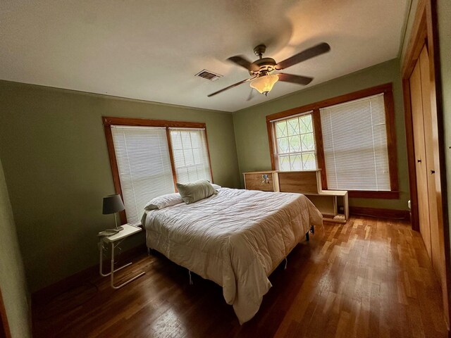 full bathroom featuring shower / bath combo, a ceiling fan, vanity, tile walls, and toilet