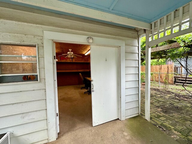 office space with unfinished concrete flooring and a workshop area
